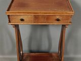 an image of a small wooden table with a drawer underneath it