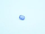a blue stone in the middle of a snow covered field