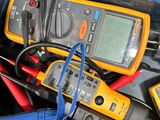 a box full of multimeters and wires in it