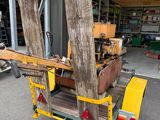 a cart that has a bunch of wood on it