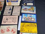 several books and pamphlets are on a table with a black table cloth