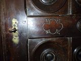 a close up of a wooden door with a lock on it