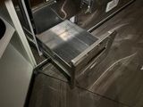 a stainless steel drawer in the middle of a kitchen