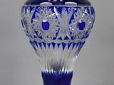 an image of a blue vase sitting on top of a table