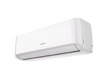 a white air conditioner sitting on top of a white wall