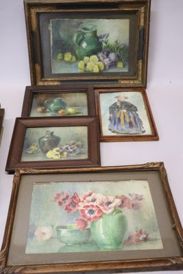 four framed pictures of flowers and fruit on the table