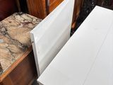 a white table with a marble top in a room