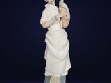 an image of a statue of a woman holding a cat