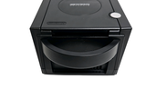 a black cd player sitting on top of a white surface