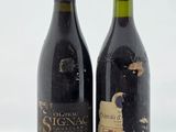deux bouteilles de vin posées l'une à côté de l'autre sur une table