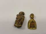 two small bronze figurines of a woman and a man