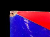a close up of a red and blue flag on a black background