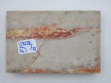 an image of a piece of marble with a sticker on it