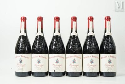 six bottles of red wine lined up in a row
