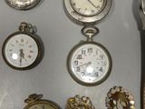 many different types of watches and bracelets on the table