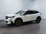 a white toyota rav parked in a room with a clock on the wall