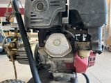 a machine that is sitting on the ground in the garage
