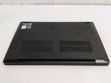 a black laptop sitting on a white surface