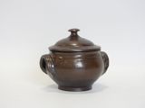 an image of a brown ceramic pot with a lid on a white background