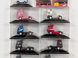 many toy cars in a display case on the wall