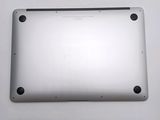 the back of a silver laptop with a small hole in the middle