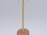 a close up of a metal object on a stand with a white background