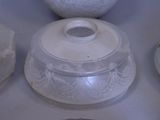 a lot of white dishes that are on the table
