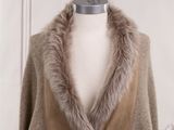 the coat is made of sued and has a fur collar
