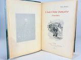 a book opened to show a picture of a horse drawn carriage