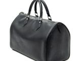black louis vuitton bag on a white background