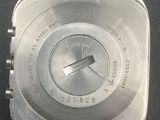 a close up of a watch on a black surface