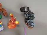 many figurines of different shapes and sizes on the table