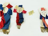 three different types of cloth dolls are displayed on a white surface