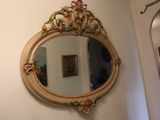 a mirror hanging on the wall above a sink