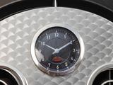a clock that is sitting on the dashboard of a car