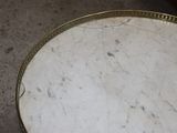 a marble table with a gold rim on it