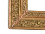 a picture of a gold picture frame on a white wall