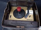 a suitcase that has a record player inside of it