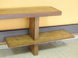 a wooden table with two shelves on it