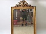 a mirror that is sitting on the floor in front of a mirror