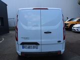 a white van that is parked in a parking lot