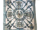 silk scarf with blue and white design of a wheel of fortune