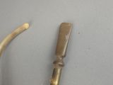 a small piece of metal that has been placed on a table