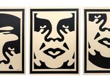 three framed black and white portraits of a man and a woman