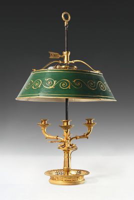 a green and gold table lamp with a bird on it