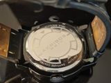 a close up of a wrist watch on a table