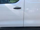 a picture of a white truck parked on the side of the road