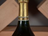 a bottle of wine that is sitting on a table