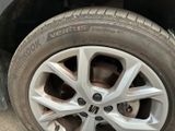 a close up of a tire on a car ' s rim