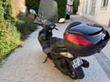 a black motorcycle parked on the side of the road
